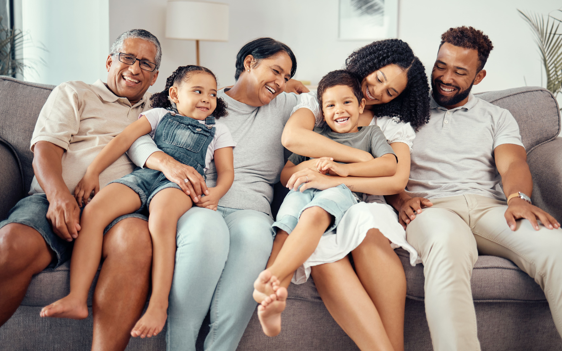 Multigenerational family relaxing together on couch