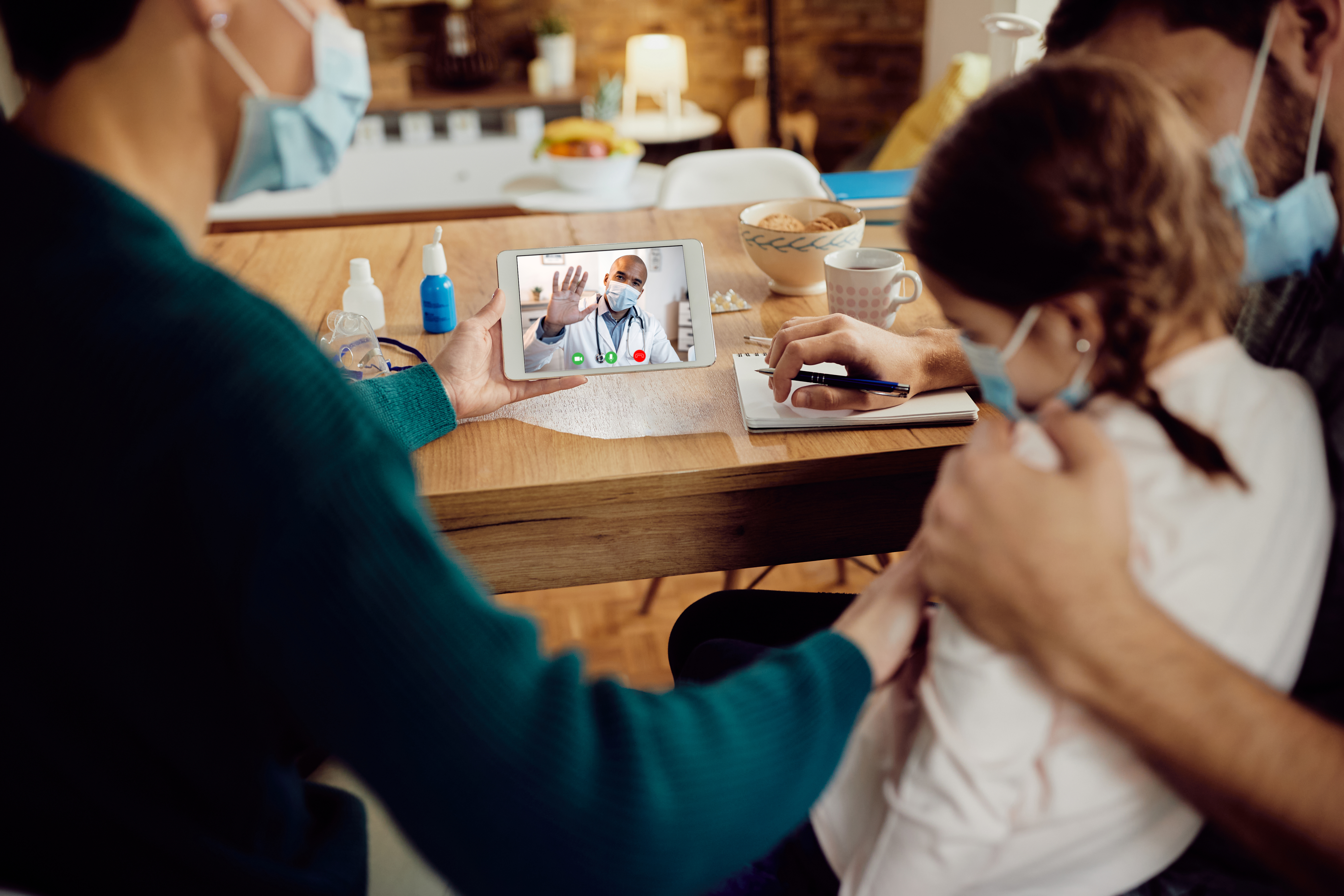 Mother with baby on virtual doctor visit